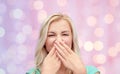 Young woman or teenage girl closing her nose Royalty Free Stock Photo