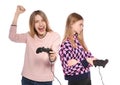 Young woman and teenage girl playing video games with controllers Royalty Free Stock Photo