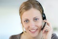 Young woman teleoperator with headset