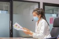 Young woman telephone operator with headset wear protection face mask against coronavirus, Customer service executive team working Royalty Free Stock Photo