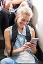 Young woman text messaging on mobile phone Royalty Free Stock Photo