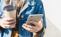 Young woman texting walking down city street Royalty Free Stock Photo