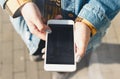 Young woman texting walking down city street Royalty Free Stock Photo