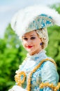 Young woman in 18th century suit.