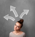 Young woman thinking with arrows above her head Royalty Free Stock Photo