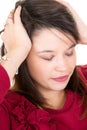 Young woman thinking and stressed hands on head