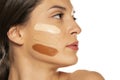 Young woman with three different tones of liquid foundation on her face Royalty Free Stock Photo