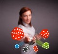 Young woman throwing dices and chips Royalty Free Stock Photo