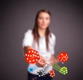 Young woman throwing dices and chips Royalty Free Stock Photo