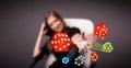 Young woman throwing dices and chips Royalty Free Stock Photo