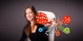 Young woman throwing dices and chips Royalty Free Stock Photo