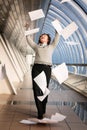 Young woman throwing documents Royalty Free Stock Photo
