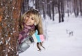 Young woman thumbs-up in winter forest Royalty Free Stock Photo