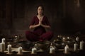 Young woman with Tibetan bowls