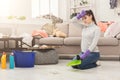 Young woman tired of spring cleaning house Royalty Free Stock Photo