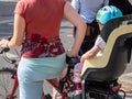 Young woman with toddler riding a bike