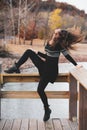 Young woman tossing her head back with long hair flying around her Royalty Free Stock Photo