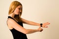 Young woman is touching the Apple Watch Royalty Free Stock Photo