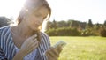 Young woman touching smartphone Royalty Free Stock Photo