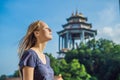 Young woman tourist in Buddhist temple Kek Lok Si in Penang, Malaysia, Georgetown Royalty Free Stock Photo