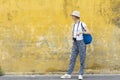 Young woman tourist with camera on street