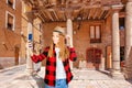 Young woman tourist enjoying great view on historical Barcelona city