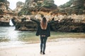 A young woman tourist enjoys beautiful views of the Atlantic Ocean and the landscape. Royalty Free Stock Photo