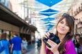 Young woman tourist holding a photo camera Royalty Free Stock Photo