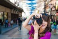 Young woman tourist holding a photo camera Royalty Free Stock Photo