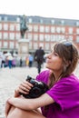 Young woman tourist holding a photo camera Royalty Free Stock Photo