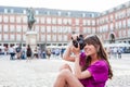 Young woman tourist holding a photo camera Royalty Free Stock Photo