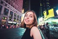 Young woman tourist laughing and taking selfie photo in New York City, Manhattan, Times Square Royalty Free Stock Photo