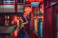 Young woman tourist looks at the Chinese traditional lanterns. Chinese New Year. Travel to China concept Royalty Free Stock Photo