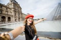 Woman visiting Louvre in Paris