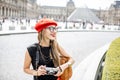 Woman visiting Louvre in Paris