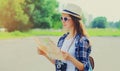 Young woman tourist sightseeing city with paper map Royalty Free Stock Photo