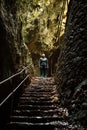 Young woman tourist walking in Plitvice Lakes National Park during colorful autumn, Croatia, Europe. Female enjoying fall colors. Royalty Free Stock Photo