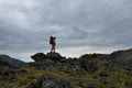 Young woman tourist walking on top of the mountain ridge Barguzinsky Royalty Free Stock Photo