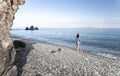 Young woman tourist watching sea landscape, Livadi beach Greece