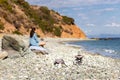 Young woman tourist watching sea landscape, Livadi beach Greece