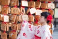 Young woman tourist wearing kimono in Kiyomizu dera temple, Kyoto, Japan. Asian girl with hair style in traditional Japanese Royalty Free Stock Photo