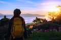 Young woman Tourists with backpacks Standing watching nature beautiful landscape view And fog on the top of the mountain Morning Royalty Free Stock Photo