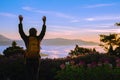 Young woman Tourists with backpacks Standing watching nature beautiful landscape view And fog on the top of the mountain Morning Royalty Free Stock Photo