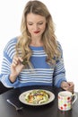 Young Woman Toying With Mixed Vegetable Salad