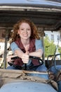 Young woman on a tractor Royalty Free Stock Photo