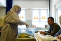 A young woman in traditional muslim clothes is seen close up voting at Saffet Ãâ¡ebi school. 64 millions turkish citizens are