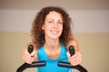 Young woman on training apparatus