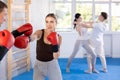 Young woman training in boxing fight in studio Royalty Free Stock Photo