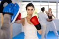 Young woman training in boxing fight in studio Royalty Free Stock Photo