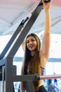 Young woman training in the gym. Pulling in gravitrone. Royalty Free Stock Photo